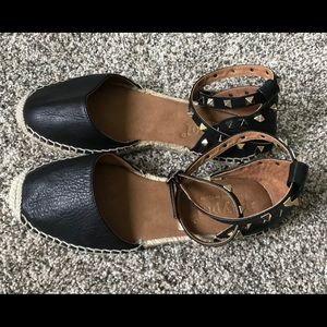 Black and gold-studded Espadrilles.